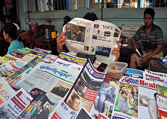 myanmar man reading the voice newspaper yangon apr1 2013